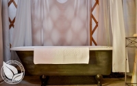 Clawfoot bath tub inside yurt at Strawhouse Resorts