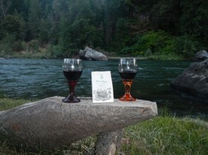 Two wine glasses on a stone at Strawhouse Resort