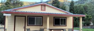 Small studio tan cottage and front porch