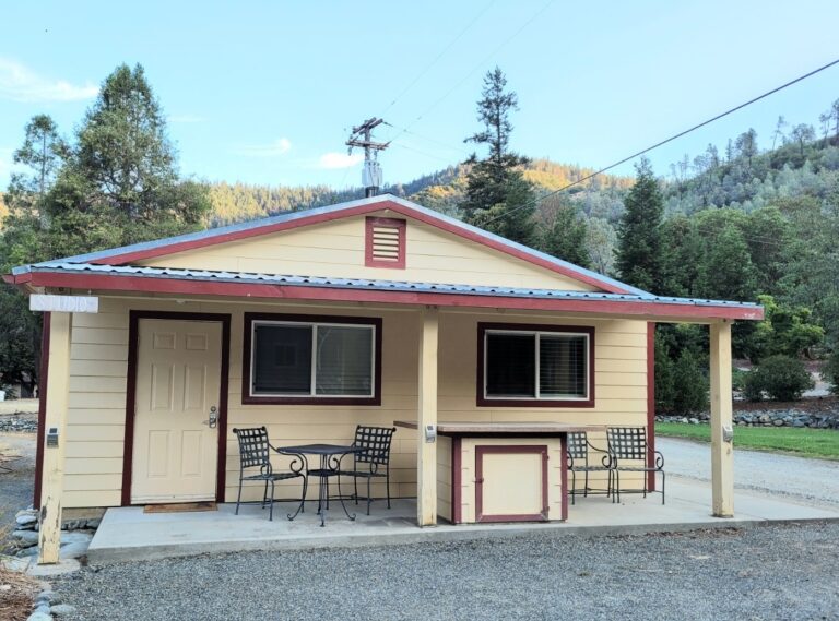 Small studio tan cottage and front porch